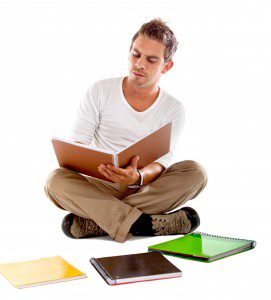 Man reviewing notebooks